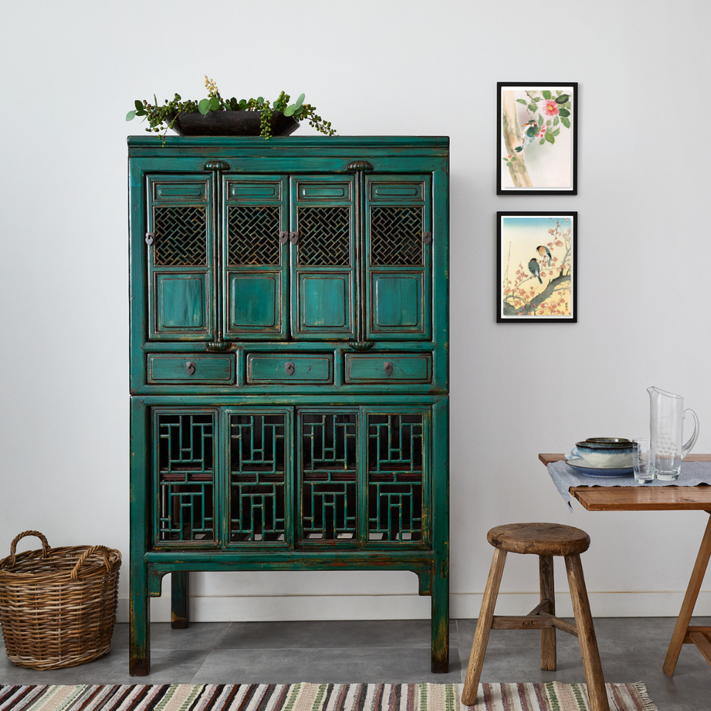 This A4 size Japanese print features two bullfinches on a plum blossom branch next to a latticework vintage Chinese cabinet