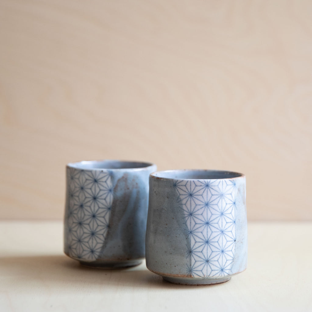 2 grey glazed cups with a patch of asanoha design