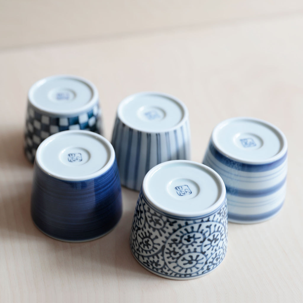 Stacked blue and white soba cups, upside down