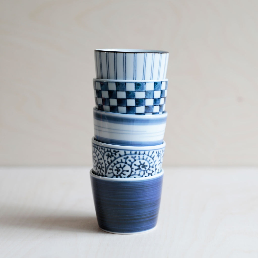 Stacked blue and white soba cups