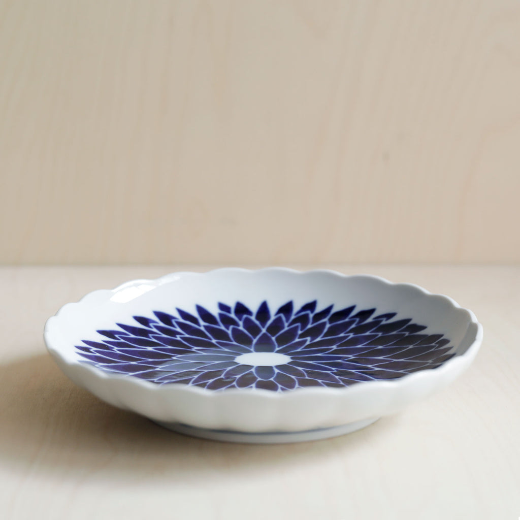 Scallop rim ceramic plate with blue flowers