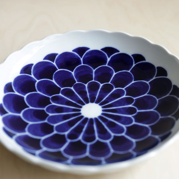 Scallop rim ceramic plate with blue flowers