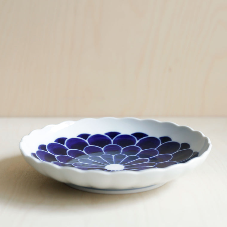 Scallop rim ceramic plate with blue flowers